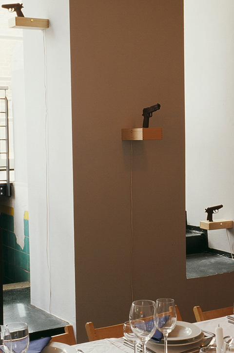 Turning chocolate guns 2sweet2kill. Wall mounted installation in restaurant