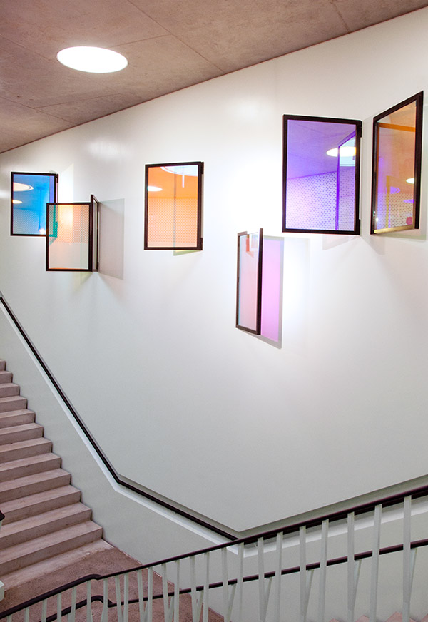 Art installation in public space, wall hanging glass panes changing colors in Berlin School by YLS Yvonne Lee Schultz