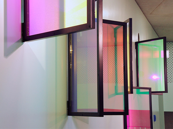 Site Specific wall hanging artwork  in school with colorful glass panes by YLS Yvonne Lee Schultz