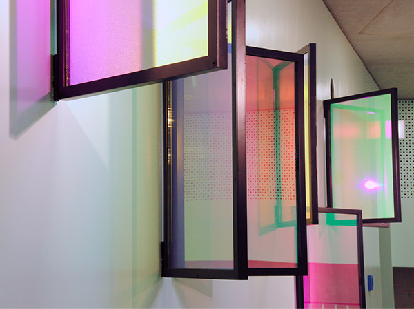 Site Specific wall hanging artwork in school with colorful glass panes by YLS Yvonne Lee Schultz
