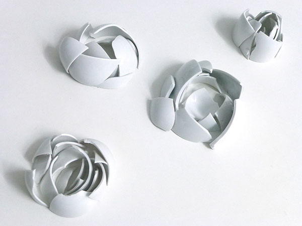rose petals of broken porcelain allude to fragility of beauty and luxury. Artist YLS Yvonne Lee Schultz
