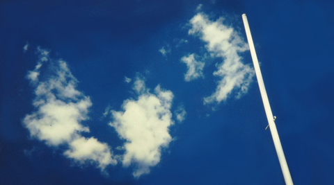 Clouds form a natural ONE SKY FLAG at empty flag pole. Photo by artist YLS Yvonne Lee Schultz