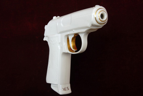 art object fragile Porcelain Pistol with Golden Rim decor by artist YLS